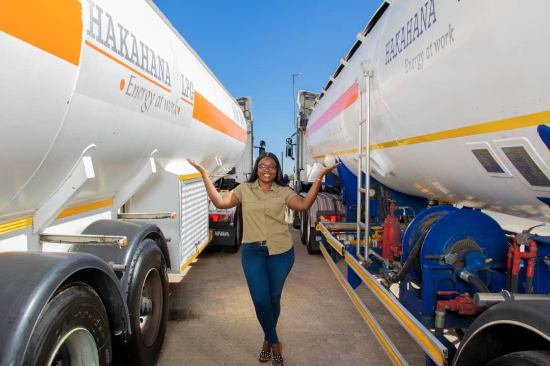 Team member standing between two LPG tankers