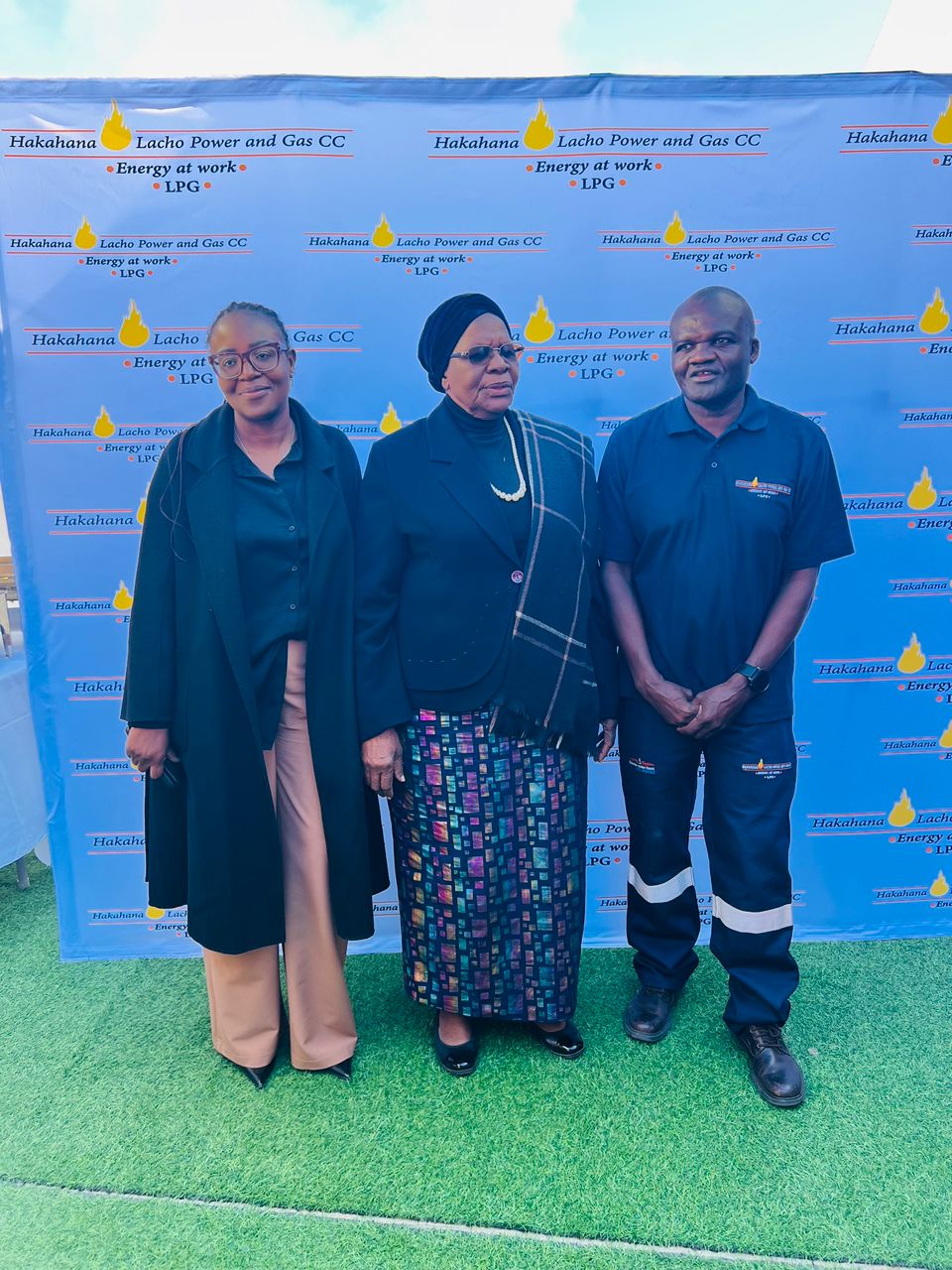 Three guests posed at the branch opening